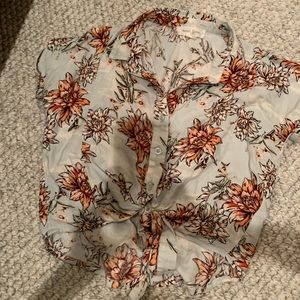 A cute crop top with a knot at the bottom